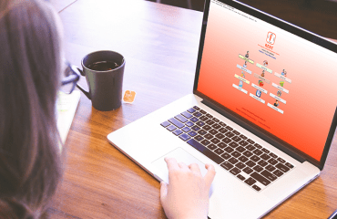 Someone using the RENT+ software on a laptop.